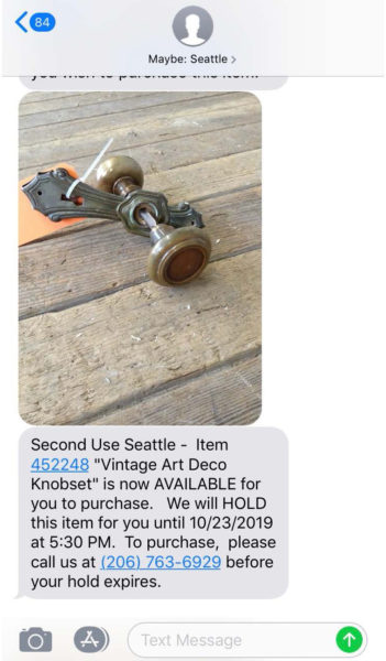 Example of a text message received for a now active hold at Second Use Building Materials.