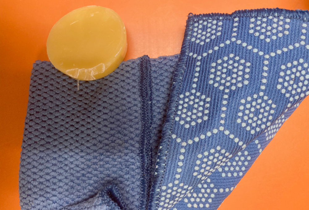 Beeswax puck and soft clothe, used for restoring the luster to your cleaned vintage hardware.